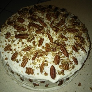 from scratch banana cake almond with cream frostingwith pecan pieces