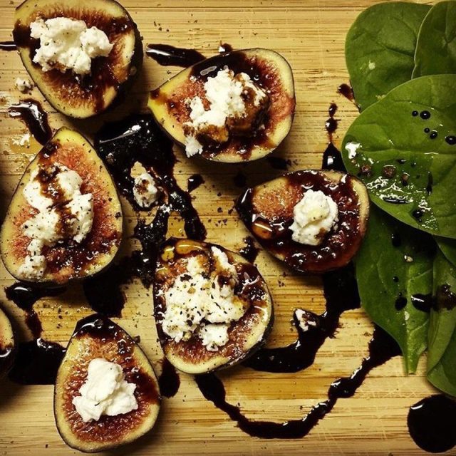 Fresh Figs Topped With Goat Cheese And Balsamic Vinegar With Baby Spinach