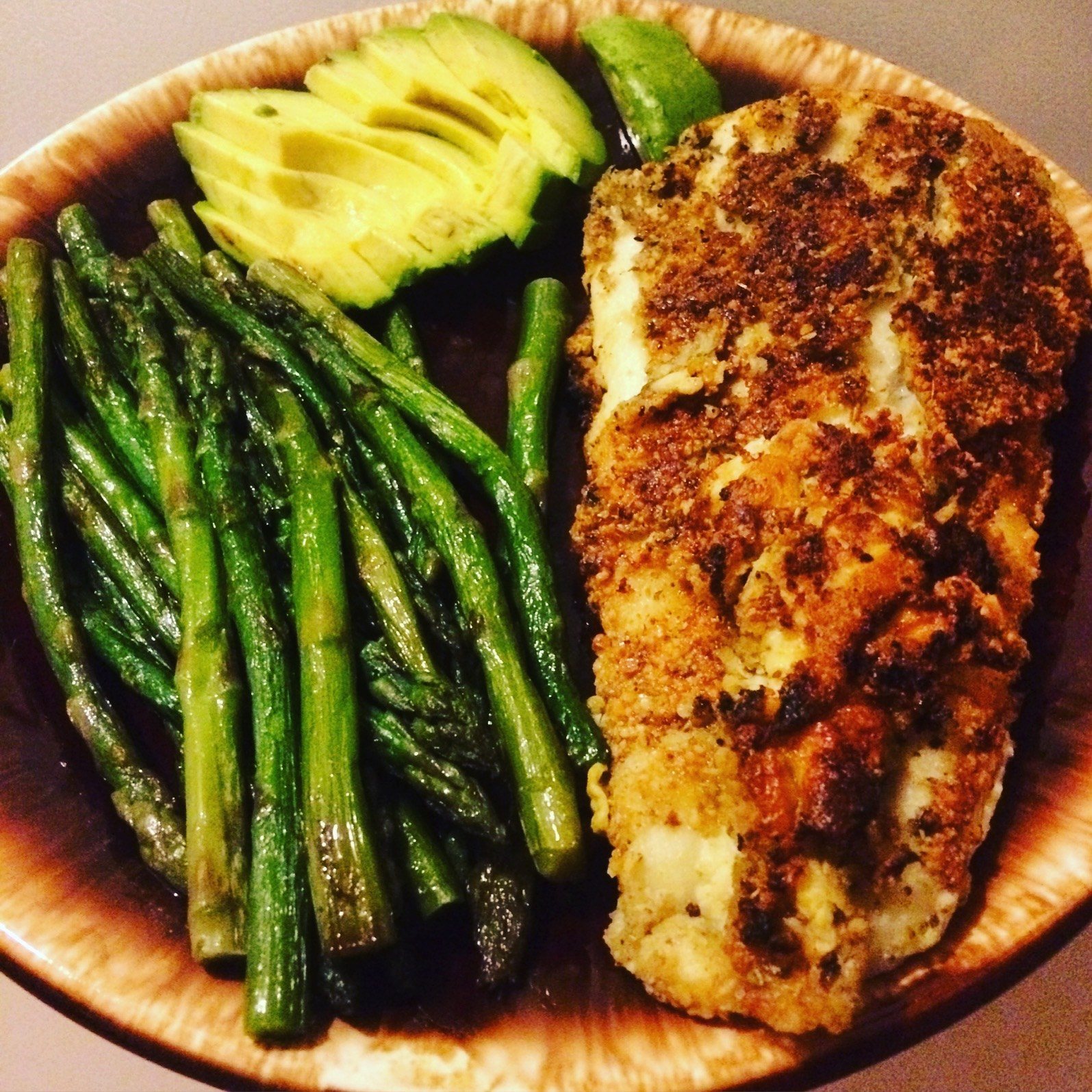 Almond Flour Crusted Halibut Fried In Coconut Oil With A Side Of Asparagus And A