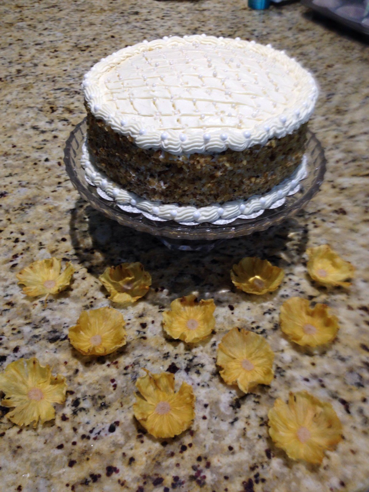 Carrot Cake With Whipped Cream Frosting With Pineapple Flowers