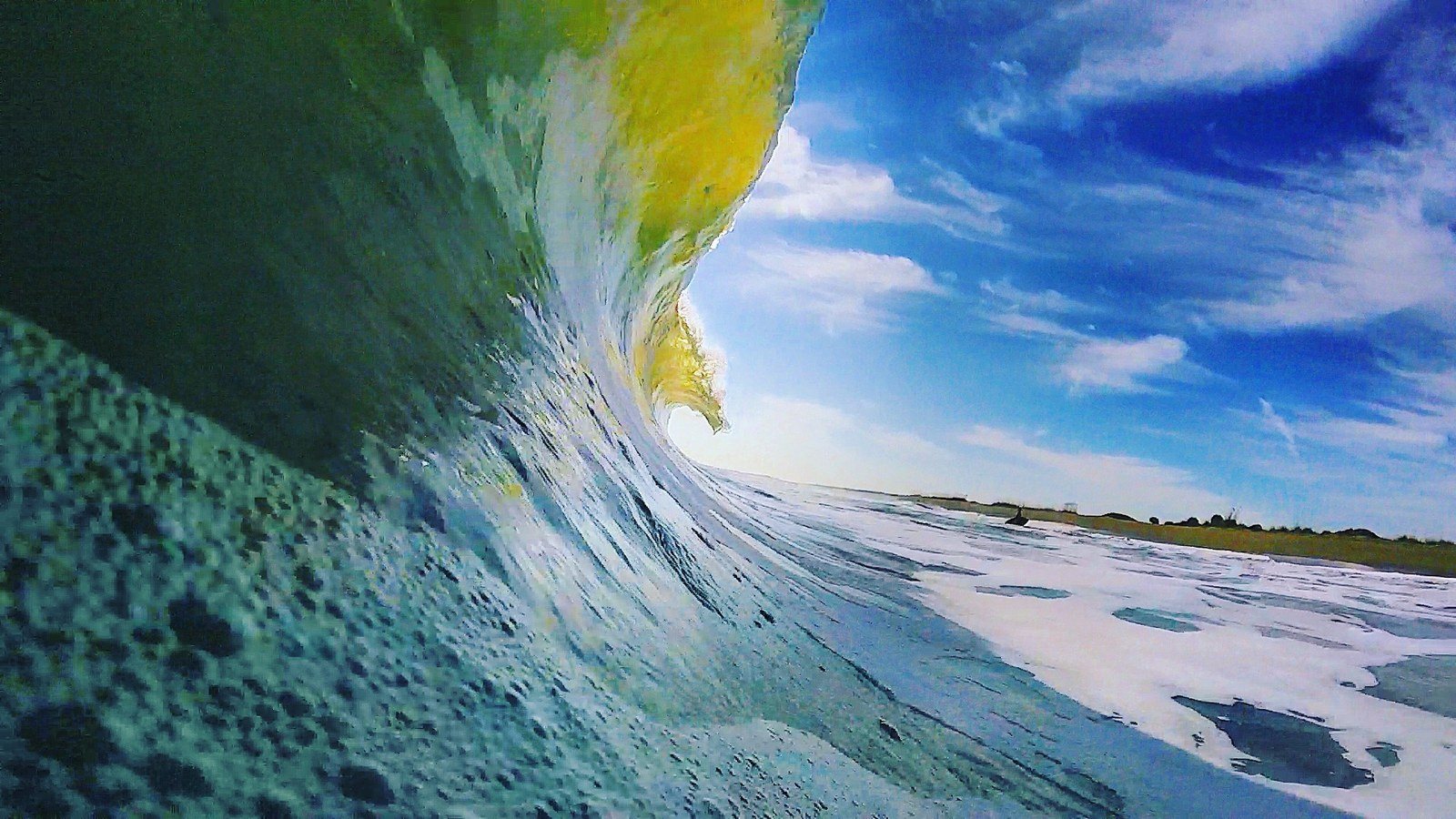 Sun Breaching Through A Perfect Wave