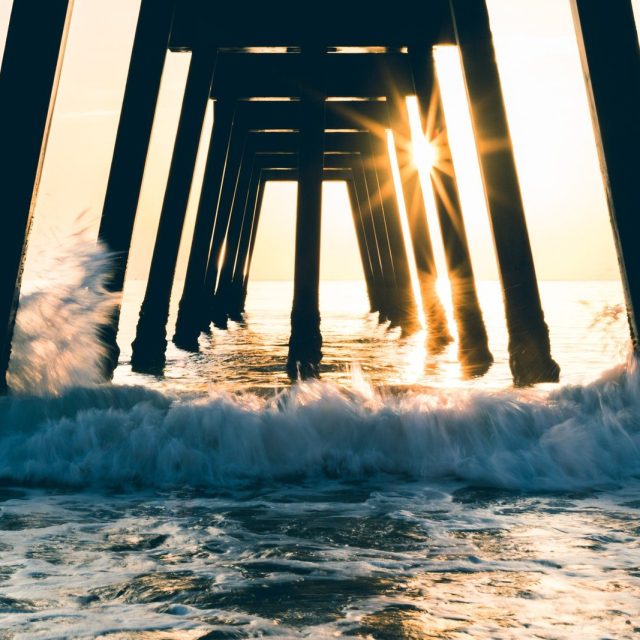 Sunrise Through The Pier