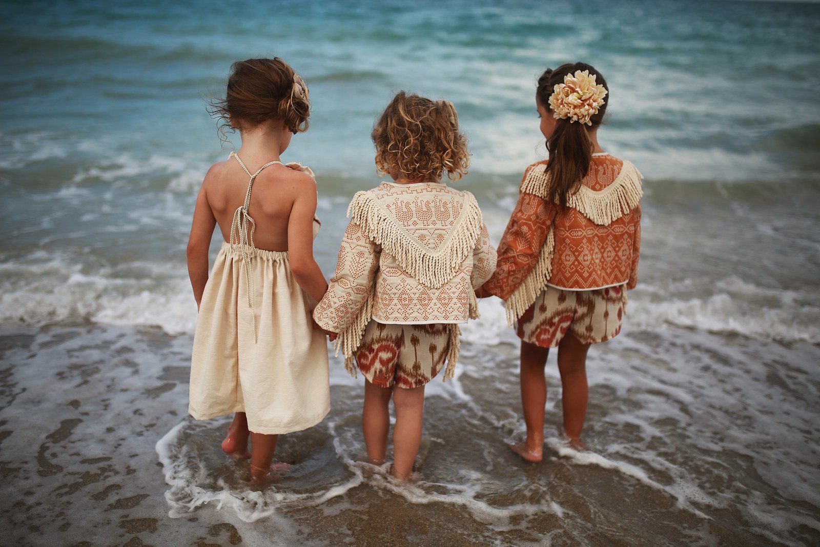 Three Girls Enjoying The Water In Their Magnolia Lake Clothing