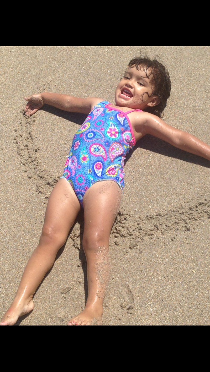 Making Sand Angels At The Beach