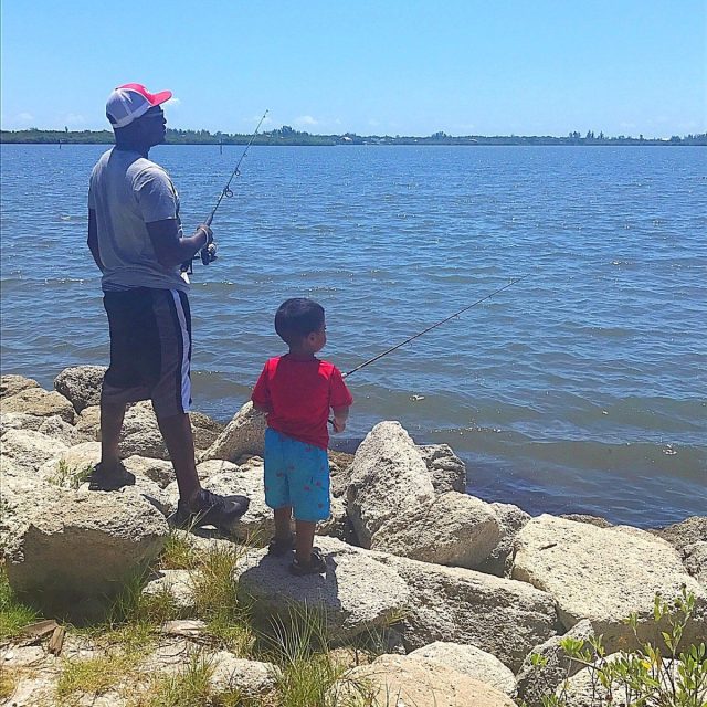 Father And Son Fishing In The River. Sebastian, FL