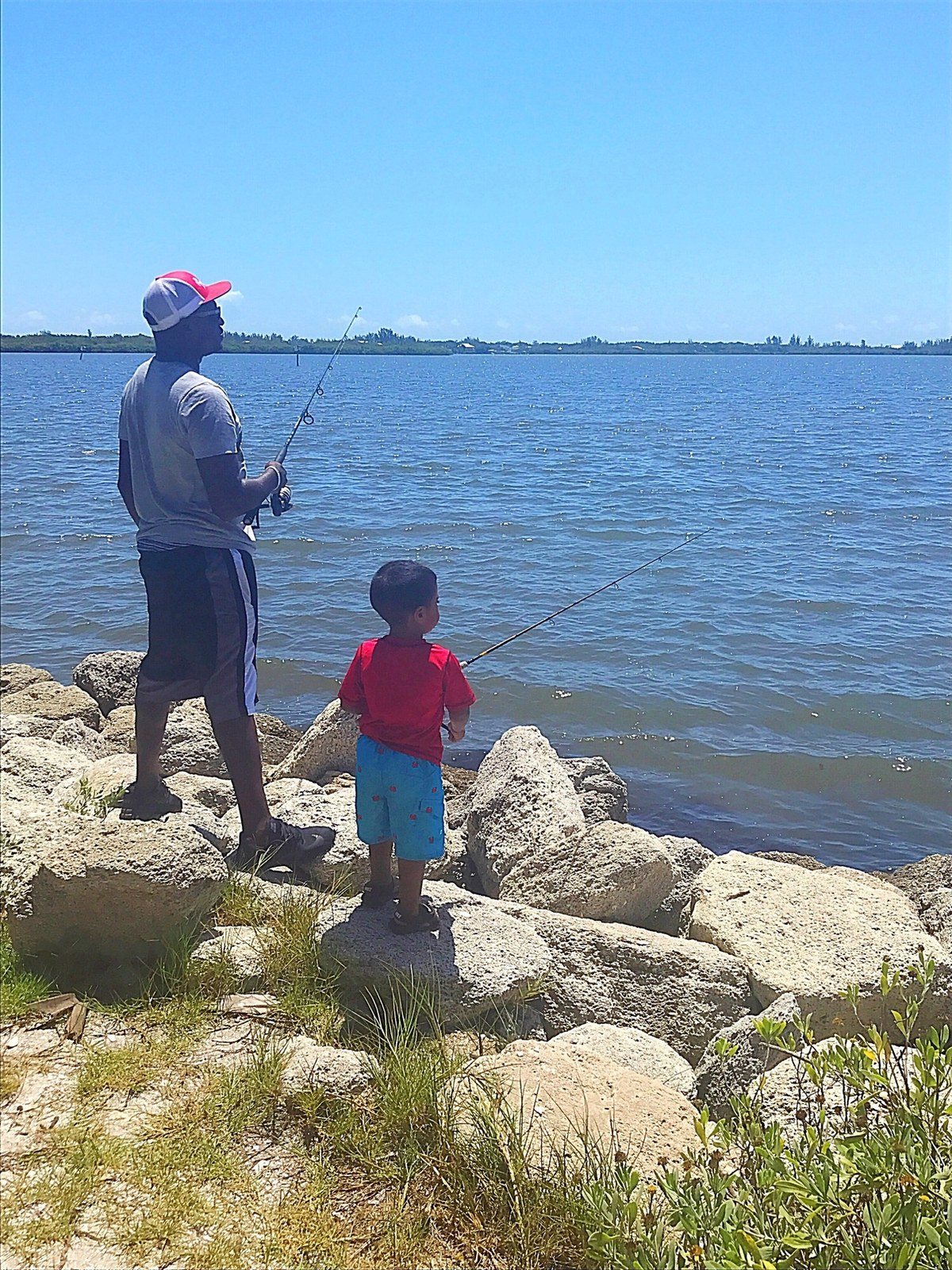 Father And Son Fishing In The River. Sebastian, FL