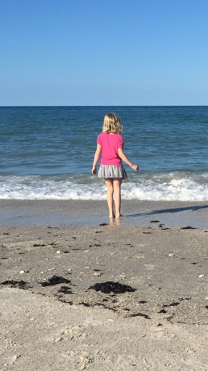 Seashell In Her Pocket And Sand Between Her Toes