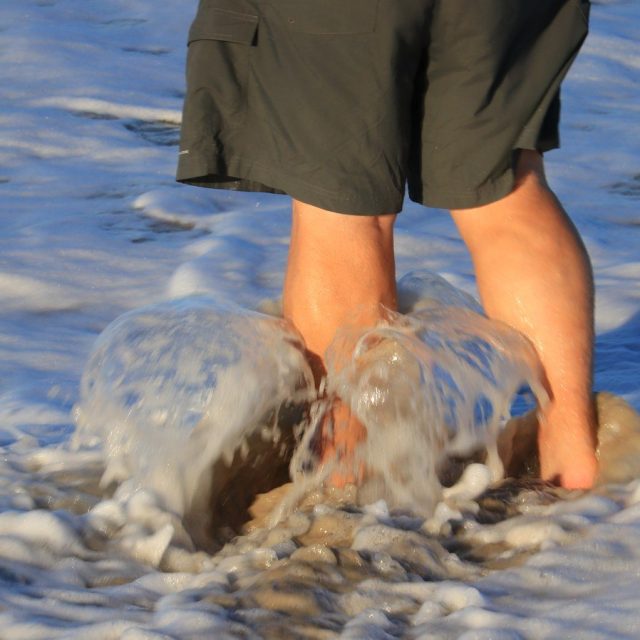 Washing His Sandy Feet
