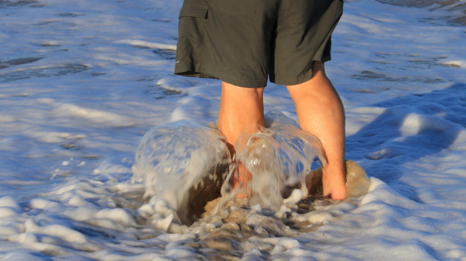 Washing His Sandy Feet