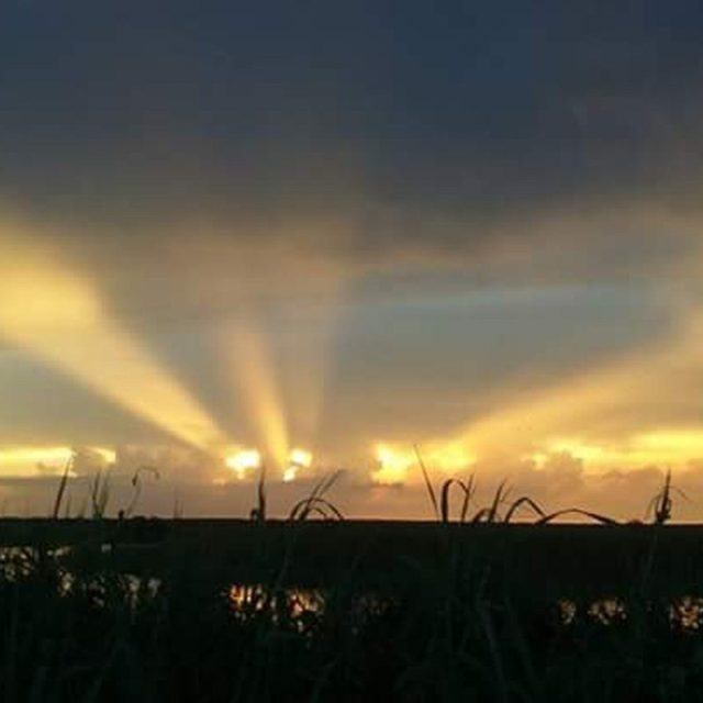Sun Rays At Sunset Over St. John's River In West Cocoa