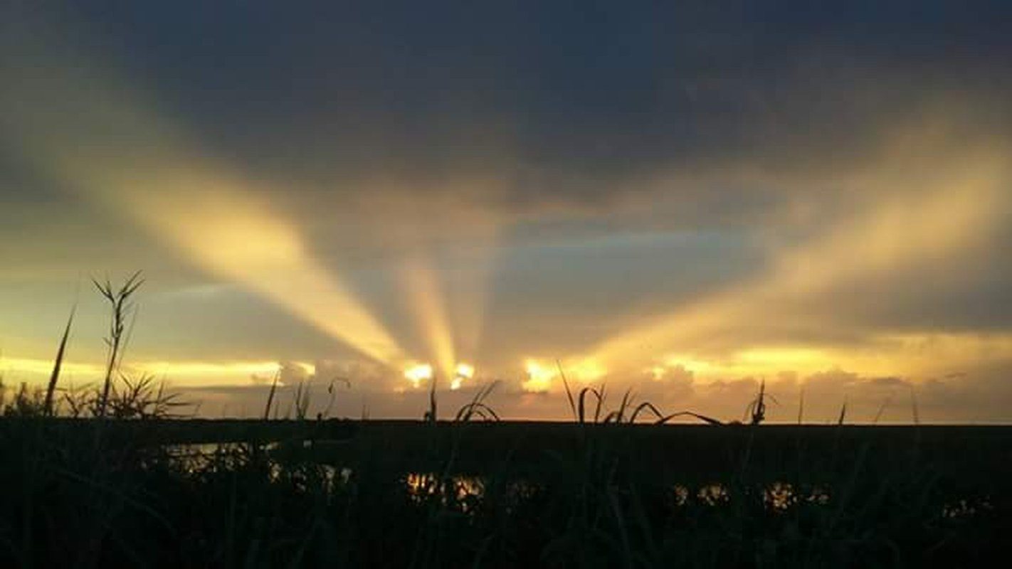 Sun Rays At Sunset Over St. John's River In West Cocoa