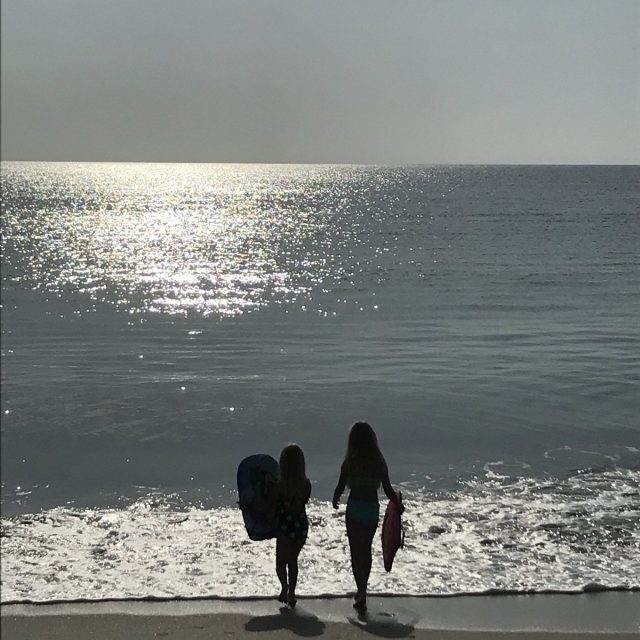 Sisters Waiting On First Waves Of The Day.
