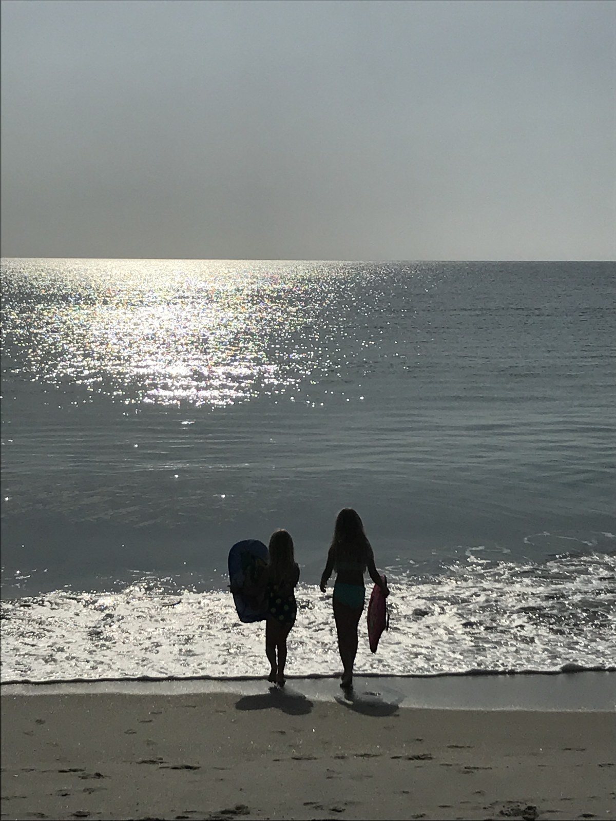 Sisters Waiting On First Waves Of The Day.