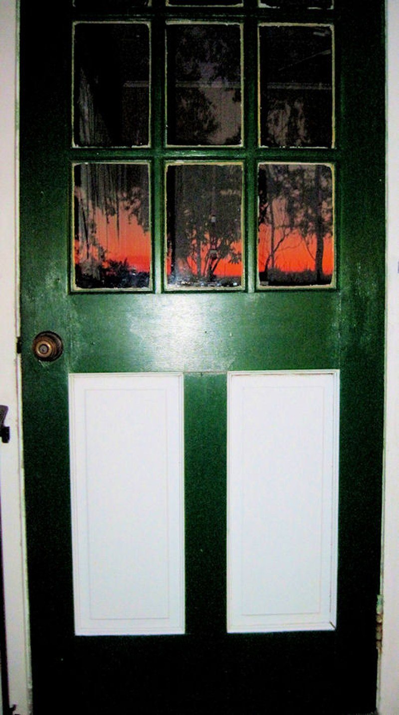 Jungle Trail Homestead Facing West. Actual Sunset Reflection In Glass